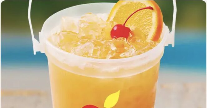 A vibrant and refreshing Bacardi Party on the Beach Bucket from Applebee's, filled to the brim with a golden cocktail made from Bacardi Lime Rum, Peach Schnapps, and a mix of passion fruit, pineapple, and orange juice, served over ice and garnished with fresh fruit slices.